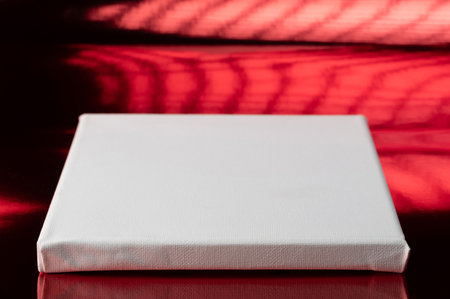 White platform space on red bright studio backgroundの写真素材