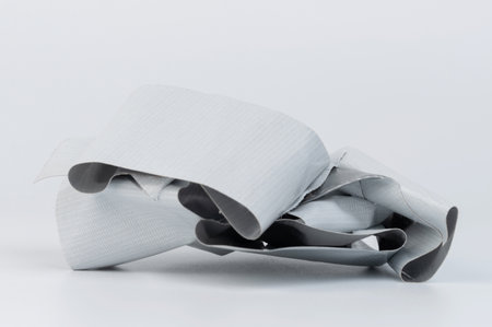 Wrinkled gray duct tape ball sticked together isolated close up viewの写真素材