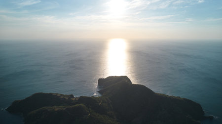 Sunset over sea coast aerial drone view. Calm ocean at duskの写真素材