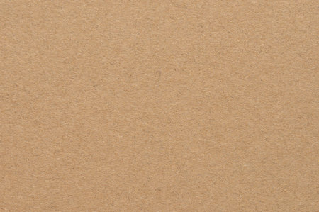 Brown craft paper offers versatile, natural background for creative projects and designs.の写真素材