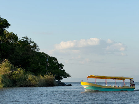 Yellow tropical boat  on sunset light background