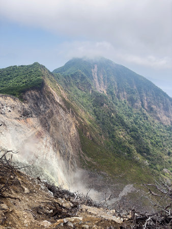 Volcano mountain cliff landscape with green forest for hikeの写真素材