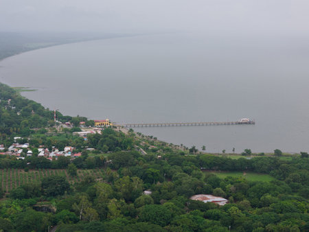 Small port in lake aerial drone view in foggy dark dayの写真素材