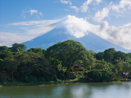 Green lake shore of Ometepe island with Concepcion volcano landscapeの写真素材