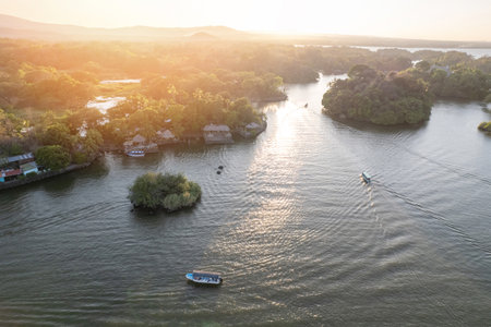 Boat tours theme in sunset gold hour aerial drone viewの写真素材