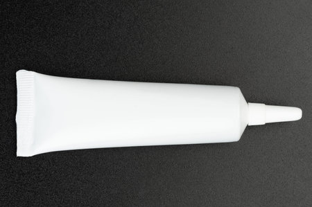 White plastic tube package for liquid creame or glue isolated