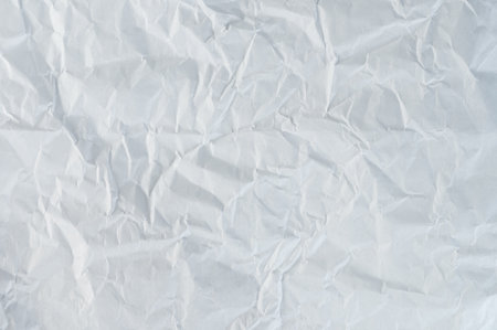 Crumple damaged white paper background macro close up viewの写真素材