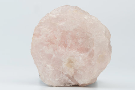 Pink raw crystal stone isolated on white studio backgroundの写真素材