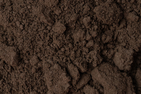 Rough brown soil structure pattern macro close up viewの写真素材