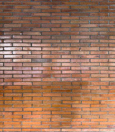 Brown glossy brick wall texture background patternの写真素材