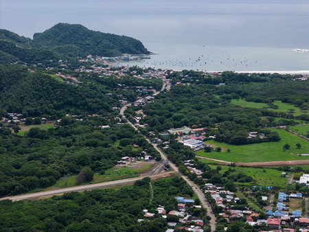Green San juan Dela Sur town landscape with bay aerial drone viewの写真素材