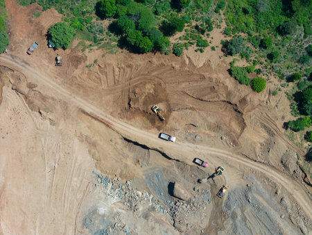 Mining mineral quarry dump with construction machinery above top viewの写真素材