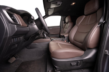 Empty leather driver seat side view with legroom isolatedの写真素材