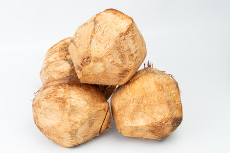 Fresh cut of pile coconuts isolated on white studio backgroundの写真素材