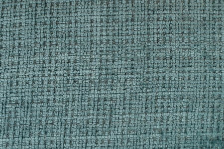 Close-up view of textured fabric in muted teal color showcasing woven pattern, ideal for design projects.の写真素材