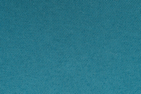 Vibrant teal fabric displays rich texture, perfect for upholstery or crafting projects. Ideal for adding color to designs.の写真素材