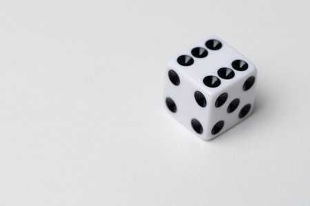 Six dots on cube dice perspective view on studio backgroundの写真素材