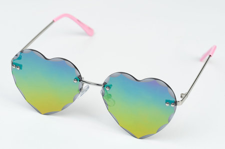 Colorful heart shape sunglasses perspective view isolated on white studio background