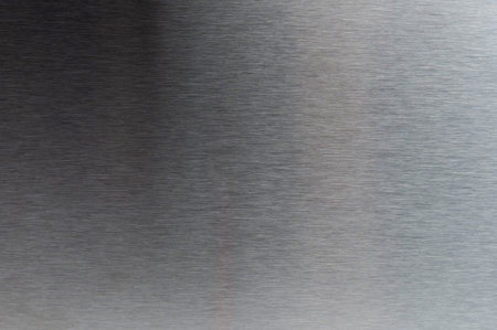 Polished metal surface background macro close up view