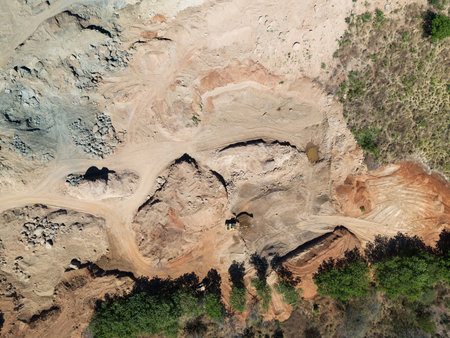 Excavator wotk in sand quarry aerial above top drone viewの写真素材