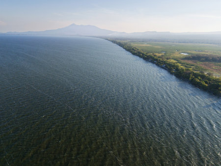 Big lake in Nicaragua next to Granada and Mombacho volcano aerial drone viewの写真素材