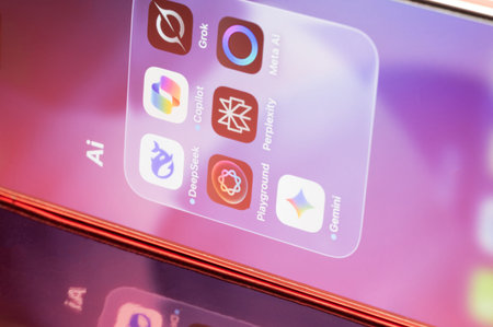 New York, USA - February 23, 2026: Ai assistants icons  application on smartphone screen close up...