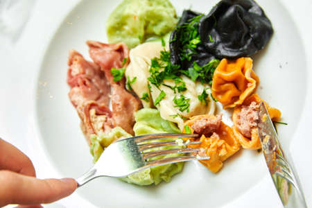 colored dumplings and spices on a light background.の写真素材