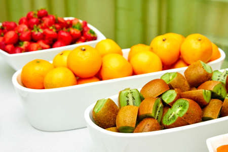 fruits on the table, oranges, kiwi, strawberriesの写真素材