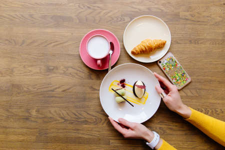 coffee time, Hands of people take desserts and coffee on tableの写真素材