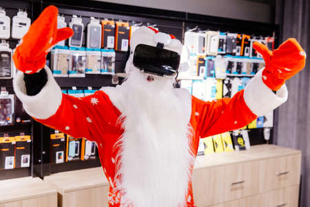 Santa Claus in appliance store in redの写真素材