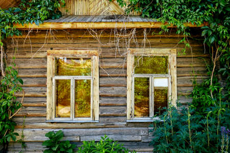 Rustic house window in the greenery, vintageの写真素材