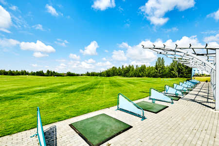 training golf course with blue sky, and greensの写真素材