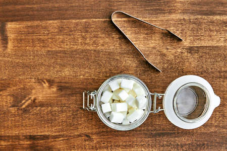 sugar cubes on wooden boardの写真素材