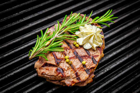 grilling steaks on grill and shot with selective focusの写真素材