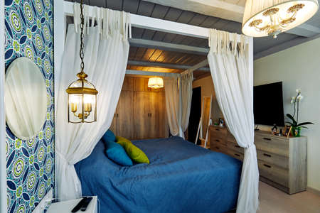 Moscow, Russia, 06.06.2018: Beautiful Furnished Bedroom with canopy in New Luxury Homeのeditorial素材