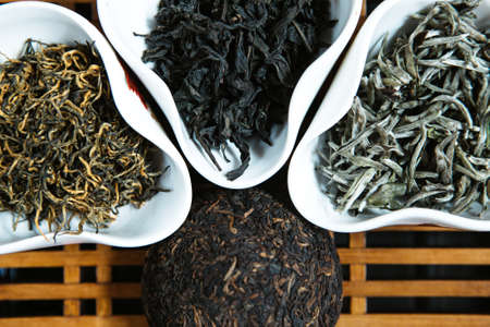 different types of tea in drinking bowlsの写真素材