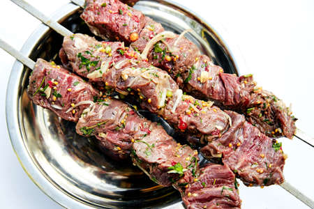 raw skewers of beef with spices and herbsの写真素材