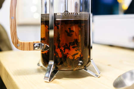 a brewing tea in a French pressの写真素材