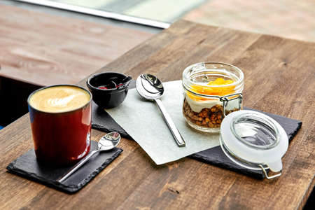 breakfast, coffee and Granola wooden deskの写真素材