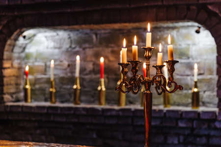 A view from below on a rich chandelier hanging from a ceilingの写真素材