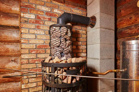 Stove with stones in the Russian bathの写真素材