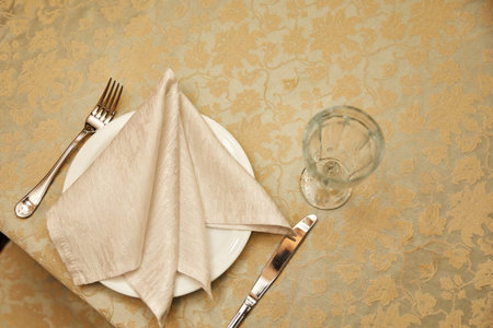 metal fork and knife on wooden tableの写真素材