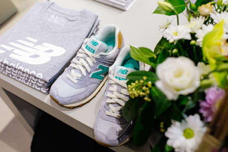 MADRID, SPAIN - SEPTEMBER 9 2018: New Balance athletic shoes on a sports shop counterのeditorial素材