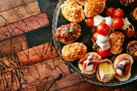 Brushetta or traditional spanish tapas. Appetizers italian antipasti snacks set with wine. Top view and flat lay with space for your textの写真素材