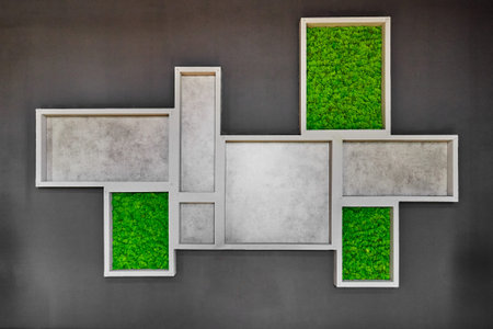 many modern wooden frames on grey wall