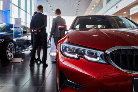 Moscow, Russia, 03.03.2019: Red car background people. Car light serviceのeditorial素材