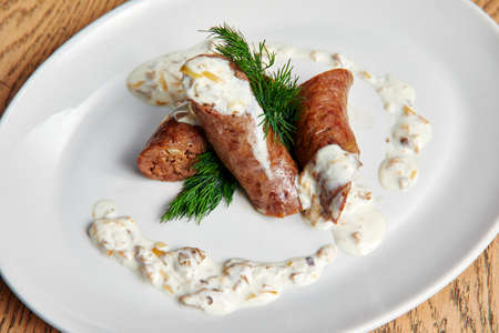 Bbq restaurant. Rustic closeup of sausages with sauce. Traditional foodの写真素材