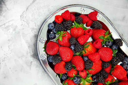 Berries raspberry blackberry strawberry on white bの写真素材