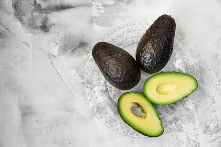 Avocado whole on white background. Natural background. Design background.の写真素材