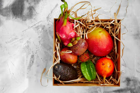 Exotic fruits box for concept design. Diet nutrition concept. Papaya tropicalの写真素材